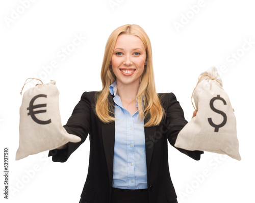 Photo: businesswoman holding money bags with euro businesswoman holding money bags with euro