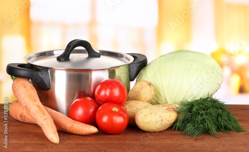Photo: Ingredients for cooking soup on table in kitchen Ingredients for cooking soup on table in kitchen