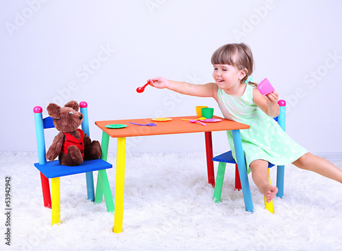 Photo: Little cute girl sitting Little cute girl sitting