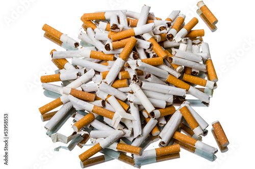 Photo: Pile of broken cigarettes top view Pile of broken cigarettes top view