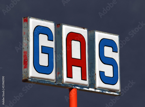 Photo: Old Decayed Gas Sign with Thunderstorm Sky Old Decayed Gas Sign with Thunderstorm Sky