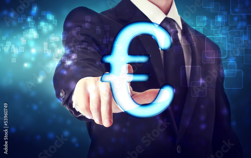 Photo: Businessman pointing Euro icon Businessman pointing Euro icon