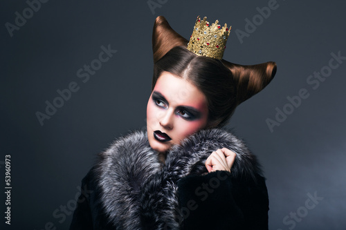 Photo: Stylized Woman in Fur Coat and Gold Grown. Nostalgia Stylized Woman in Fur Coat and Gold Grown. Nostalgia