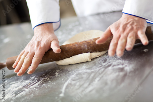 Photo: Chef preparing dough in a kitchen Chef preparing dough in a kitchen
