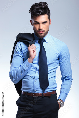 Photo: business man with jacket on shoulder business man with jacket on shoulder