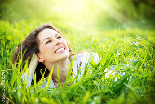 Photo: Young Woman Outdoors. Enjoy Nature Young Woman Outdoors. Enjoy Nature