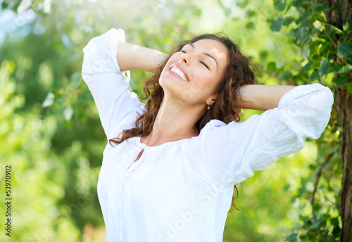 Photo: Beautiful Young Woman Outdoor. Enjoy Nature Beautiful Young Woman Outdoor. Enjoy Nature