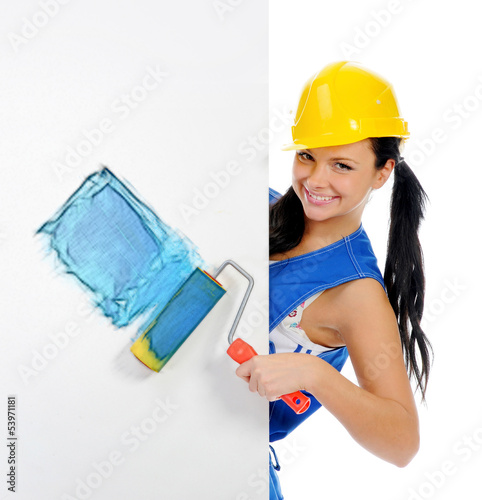 Photo: Beautiful young woman doing repairs Beautiful young woman doing repairs