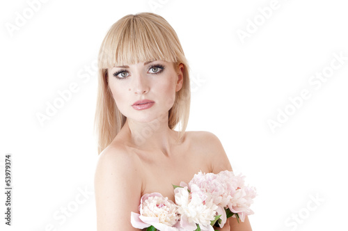 Photo: Sensual portrait of a blond woman with flowers on a white. Sensual portrait of a blond woman with flowers on a white.