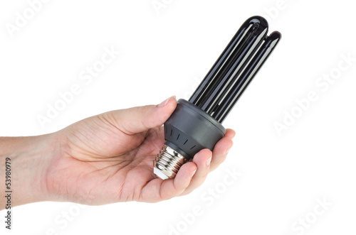 Photo: Black (UV) fluorescent lamp with e27 base in hand Black (UV) fluorescent lamp with e27 base in hand