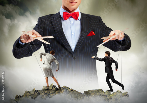 Photo: Businessman puppeteer Businessman puppeteer