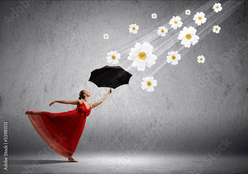 Photo: Ballet dancer in flying satin dress with umbrella Ballet dancer in flying satin dress with umbrella