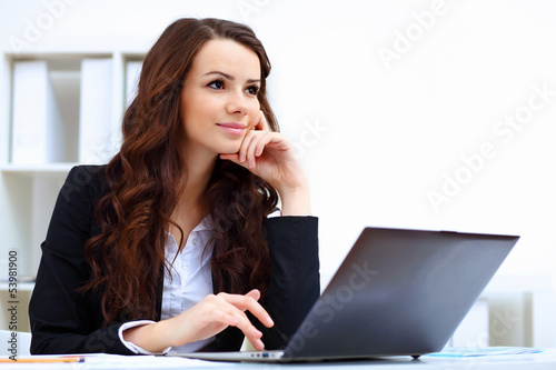 Photo: Young busines woman with notebook Young busines woman with notebook