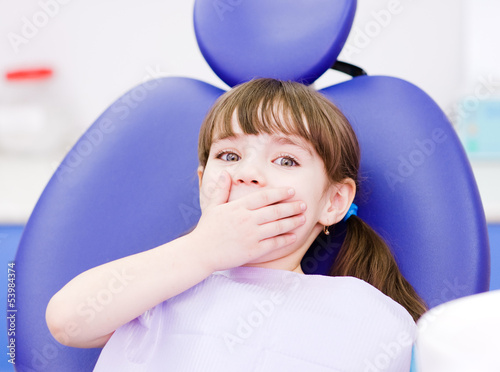 Photo: frightened girl at dentist's office frightened girl at dentist's office