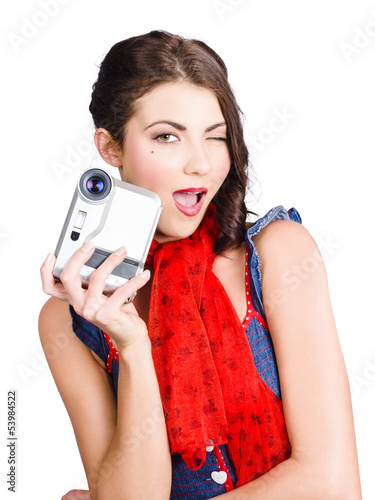 Photo: Woman holding a home video camera. Making movies Woman holding a home video camera. Making movies