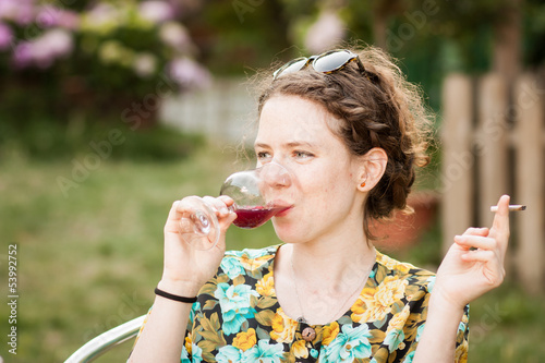 Photo: Beautiful young woman drinking sangria Beautiful young woman drinking sangria