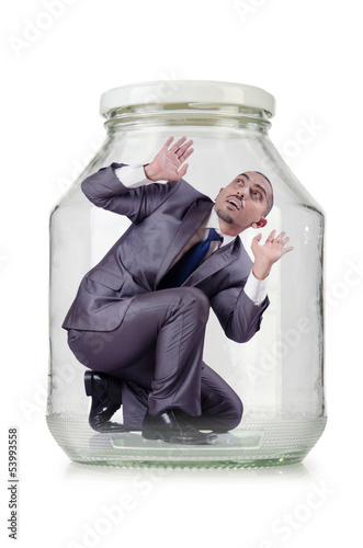 Photo: Young businessman in glass jar Young businessman in glass jar