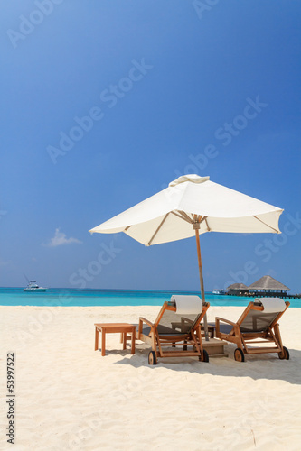 Photo: Scenery of the beach with a white parasol Scenery of the beach with a white parasol