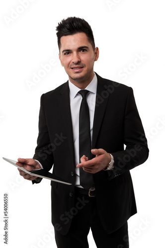 Photo: Businessman smiling and pointing at a tablet Businessman smiling and pointing at a tablet