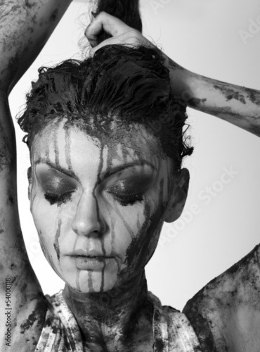Photo: woman covered in mud woman covered in mud