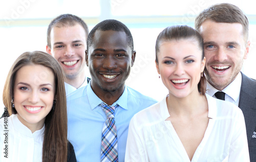 Photo: Closeup portrait of a successful business team laughing together Closeup portrait of a successful business team laughing together