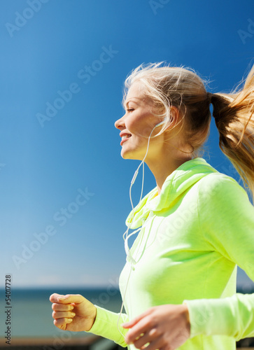 Photo: woman doing running outdoors woman doing running outdoors