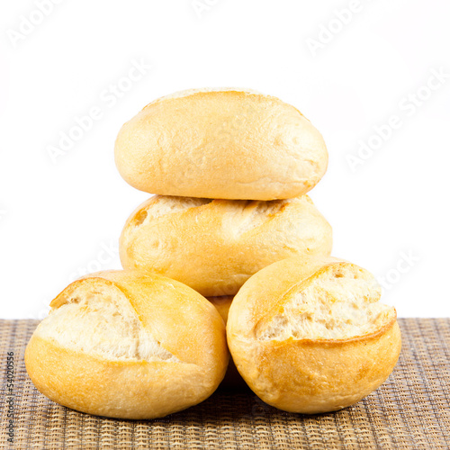 Photo: Bread on a white background. delicious buns isolated on white Bread on a white background. delicious buns isolated on white