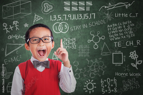 Photo: Asian boy student has idea in class Asian boy student has idea in class