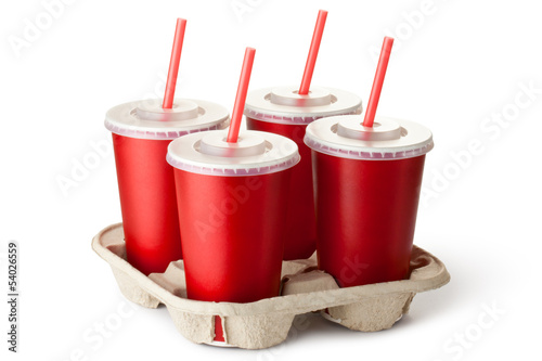 Photo: Four red takeout cups in a cup holder Four red takeout cups in a cup holder