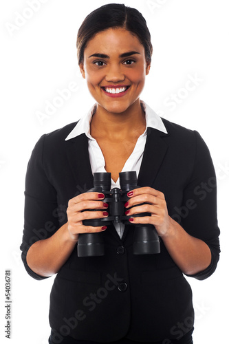Photo: Woman with binoculars looking at you Woman with binoculars looking at you