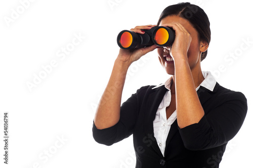 Photo: Corporate woman viewing through binoculars Corporate woman viewing through binoculars