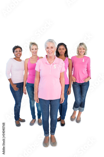 Photo: Diverse group of happy women wearing pink tops and breast cancer Diverse group of happy women wearing pink tops and breast cancer