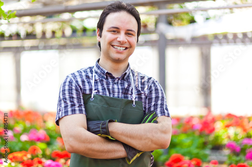 Photo: Greenhouse employee Greenhouse employee