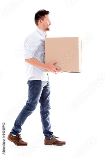 Photo: Business man carrying a box Business man carrying a box