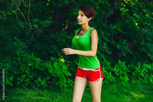 Photo: healthy beautiful young brunette woman athlete running outdoors, healthy beautiful young brunette woman athlete running outdoors,