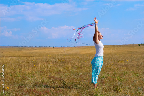 Photo: young woman with flutter ribbons young woman with flutter ribbons