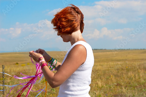 Photo: young woman with ribbons young woman with ribbons