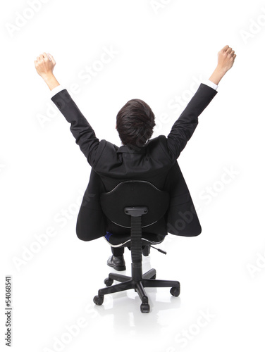 Photo: Successful excited Business man sitting in chair Successful excited Business man sitting in chair