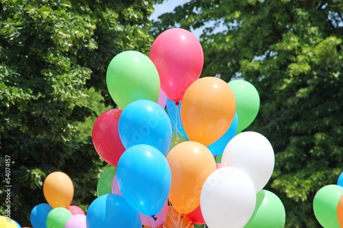 Photo: balloons during a party for children and background leaves and g balloons during a party for children and background leaves and g