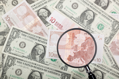 Photo: Focusing on Euro banknote against US and Euro currencies Focusing on Euro banknote against US and Euro currencies