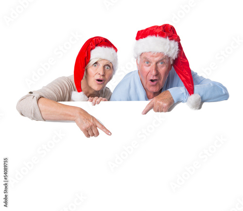 Photo: pärchen mit plakat zu weihnachten pärchen mit plakat zu weihnachten