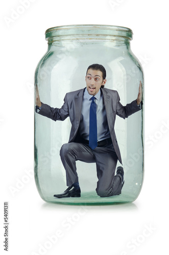 Photo: Young businessman in glass jar Young businessman in glass jar