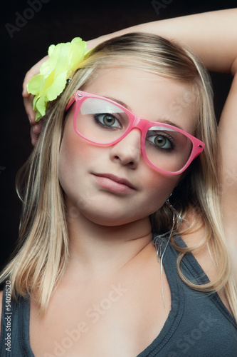 Photo: young beauty with pink glasses young beauty with pink glasses
