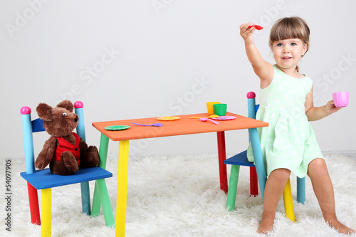 Photo: Little cute girl sitting Little cute girl sitting