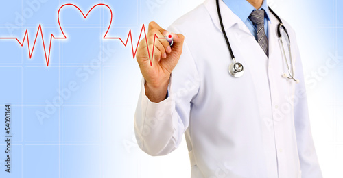 Photo: Medical doctor draws cardiogram on blue background Medical doctor draws cardiogram on blue background