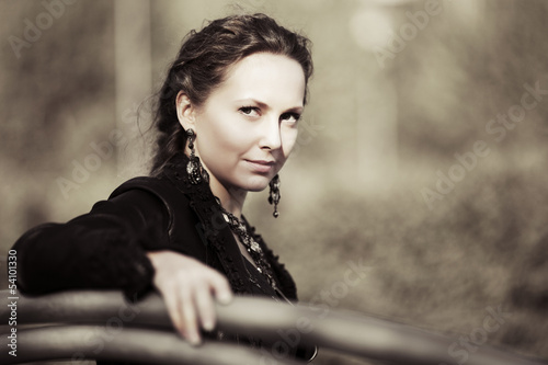 Photo: Young woman sitting on the bench Young woman sitting on the bench