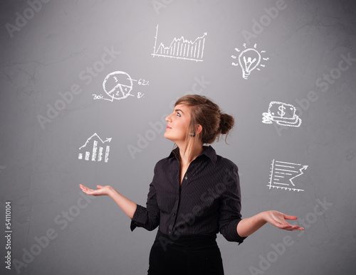 Photo: beautiful young woman juggling with statistics and graphs beautiful young woman juggling with statistics and graphs