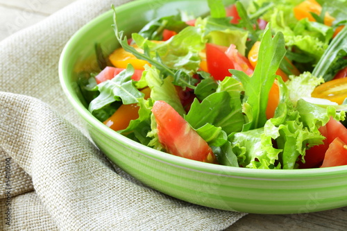 Photo: fresh healthy salad with tomatoes and arugula fresh healthy salad with tomatoes and arugula