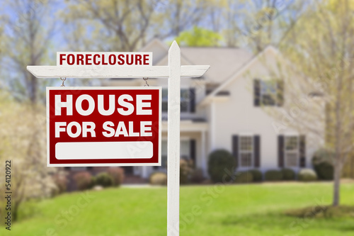 Photo: Foreclosure Home For Sale Sign in Front of House Foreclosure Home For Sale Sign in Front of House