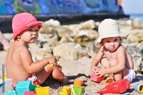 Photo: baby girls with sand baby girls with sand
